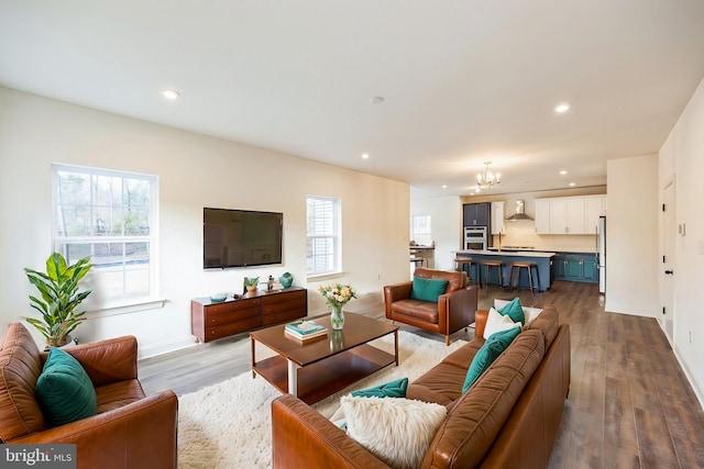 305 Poplar Ave, Newark, DE 19711 - living area with recessed lighting, baseboards, an inviting chandelier, and wood finished floors