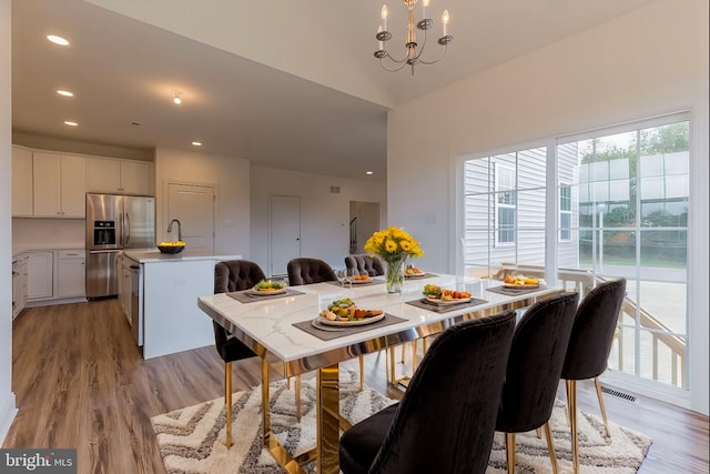 305 Poplar Ave, Newark, DE 19711 - dining area with light wood finished floors, recessed lighting, visible vents, and an inviting chandelier
