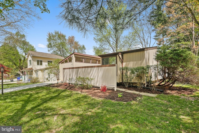 view of yard with a sunroom