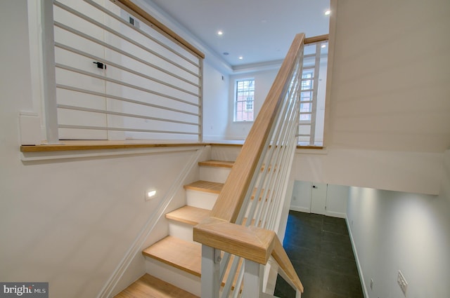 staircase with recessed lighting and baseboards