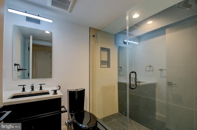 full bathroom featuring recessed lighting, a shower stall, visible vents, and vanity