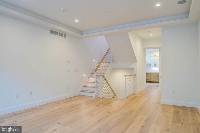 interior space featuring light wood-style floors, baseboards, visible vents, and recessed lighting