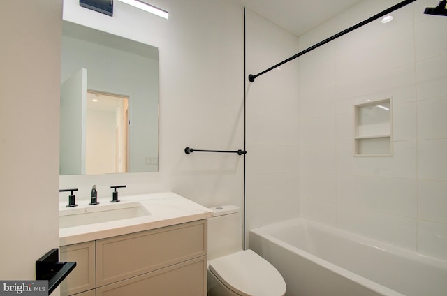 bathroom with toilet, bathing tub / shower combination, and vanity