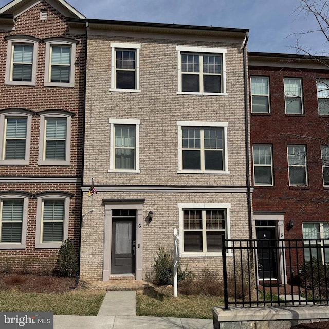 multi unit property featuring brick siding