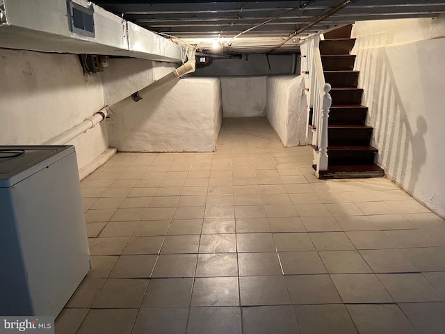 finished basement with washer / dryer and stairs