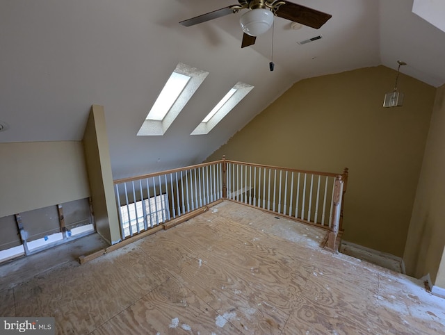 bonus room with vaulted ceiling, a ceiling fan, and visible vents