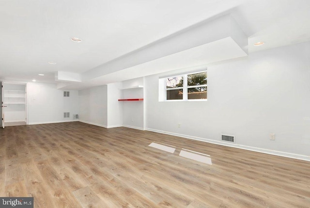 interior space featuring recessed lighting, baseboards, visible vents, and light wood-type flooring