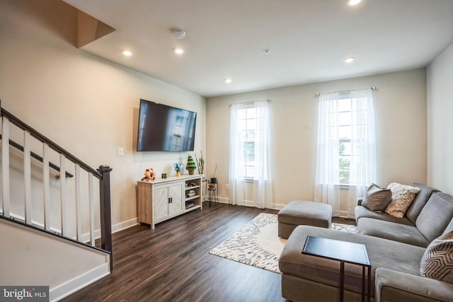 living area featuring dark wood-style floors, recessed lighting, stairway, and baseboards