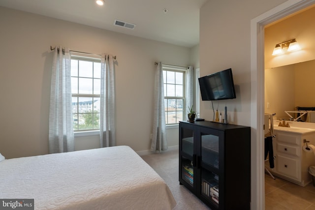 bedroom featuring recessed lighting, visible vents, baseboards, and multiple windows