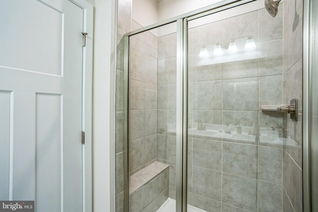 bathroom with a shower stall