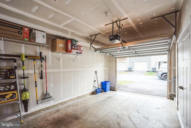 garage featuring a garage door opener