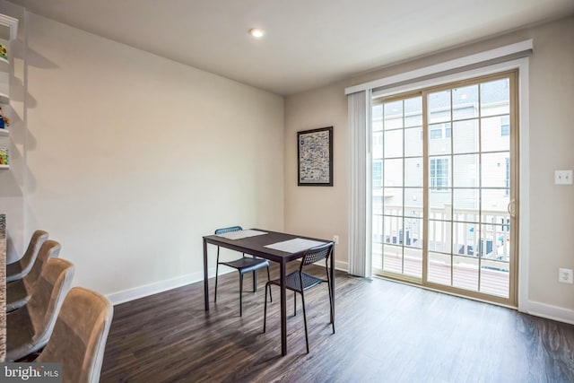 office area with dark wood finished floors and baseboards