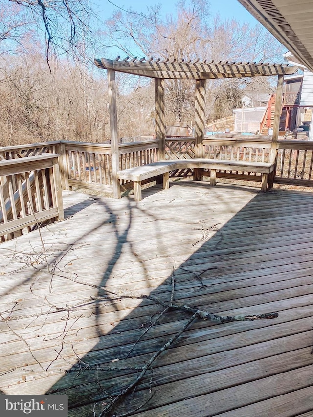 wooden terrace with a pergola