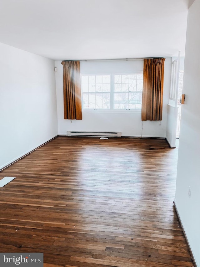 unfurnished room featuring dark wood-style floors