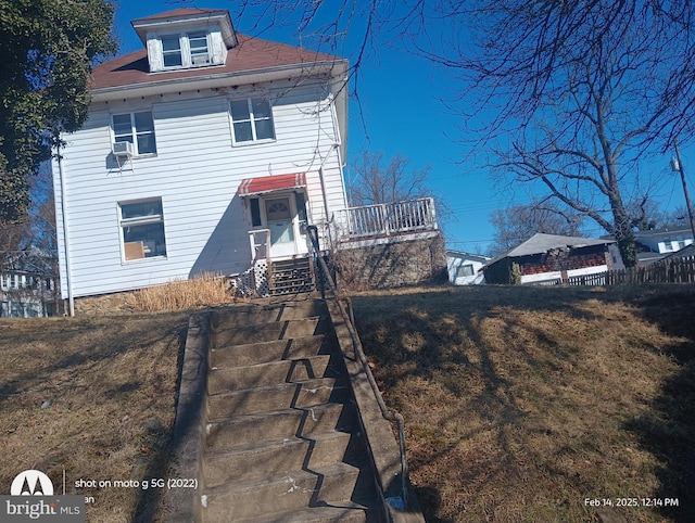 view of front of house with stairs