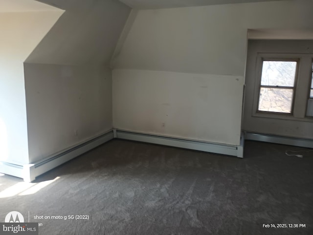 bonus room with carpet and vaulted ceiling