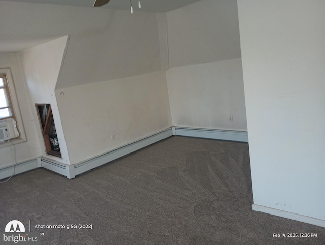 additional living space featuring ceiling fan, vaulted ceiling, and carpet flooring