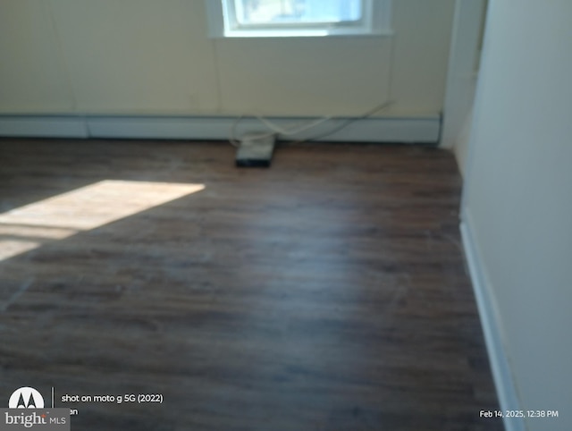 empty room featuring wood finished floors