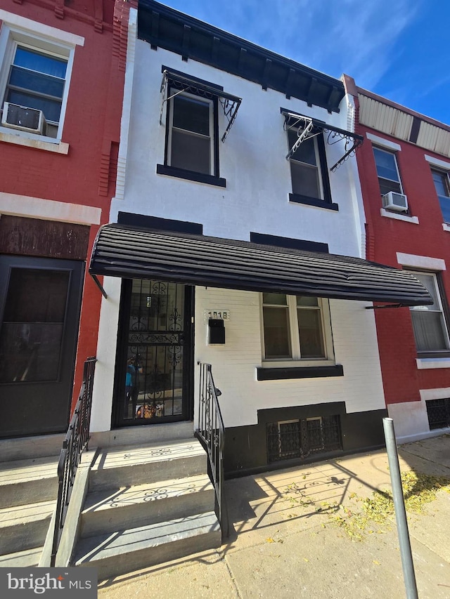 view of front of home featuring cooling unit