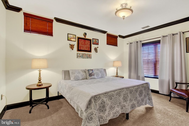 bedroom with baseboards, carpet floors, visible vents, and crown molding