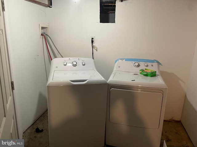 laundry room featuring laundry area and washing machine and clothes dryer