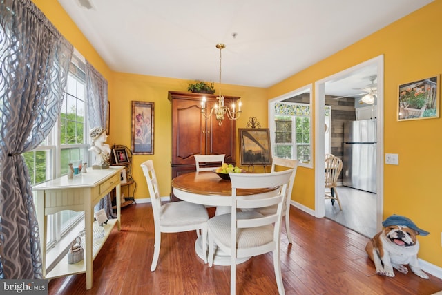 dining room featuring plenty of natural light and baseboards