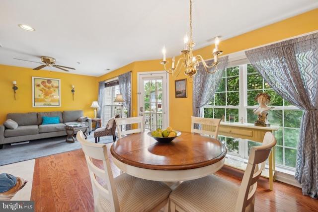 dining space with wood finished floors, plenty of natural light, a chandelier, ceiling fan, and recessed lighting