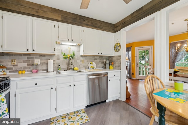 kitchen featuring stainless steel dishwasher, a sink, dark wood finished floors, and white cabinetry