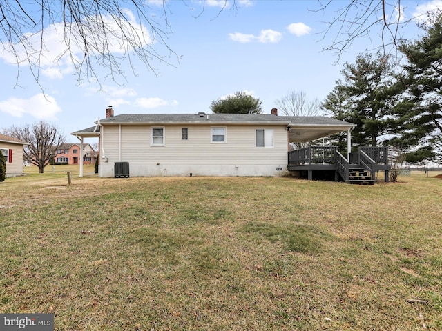 back of house with a yard, a chimney, a wooden deck, and central air condition unit