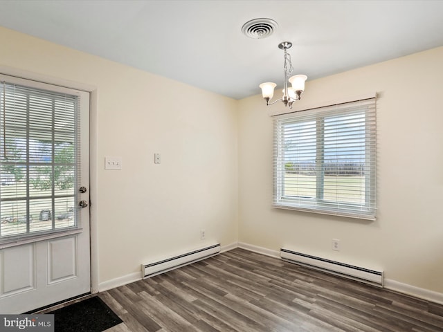 unfurnished dining area featuring visible vents, a baseboard heating unit, and a wealth of natural light