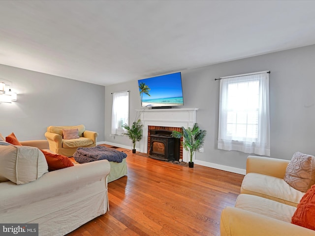 living area with wood finished floors and baseboards