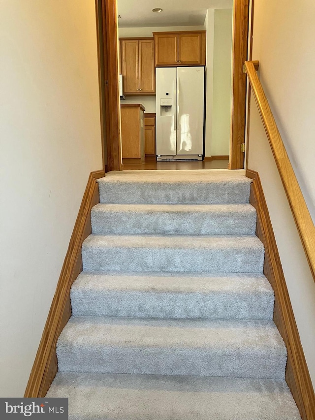 stairs featuring baseboards