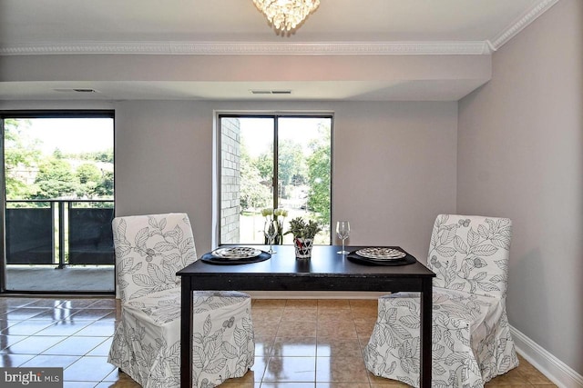 dining space with visible vents, baseboards, ornamental molding, and tile patterned flooring