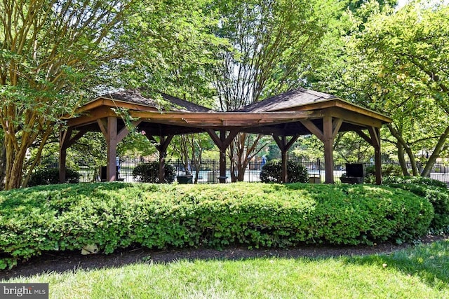 view of community with a gazebo and fence