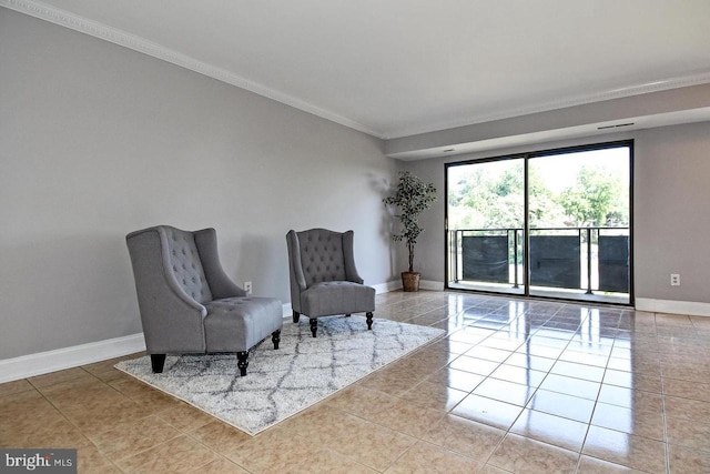 living area with tile patterned floors, crown molding, and baseboards