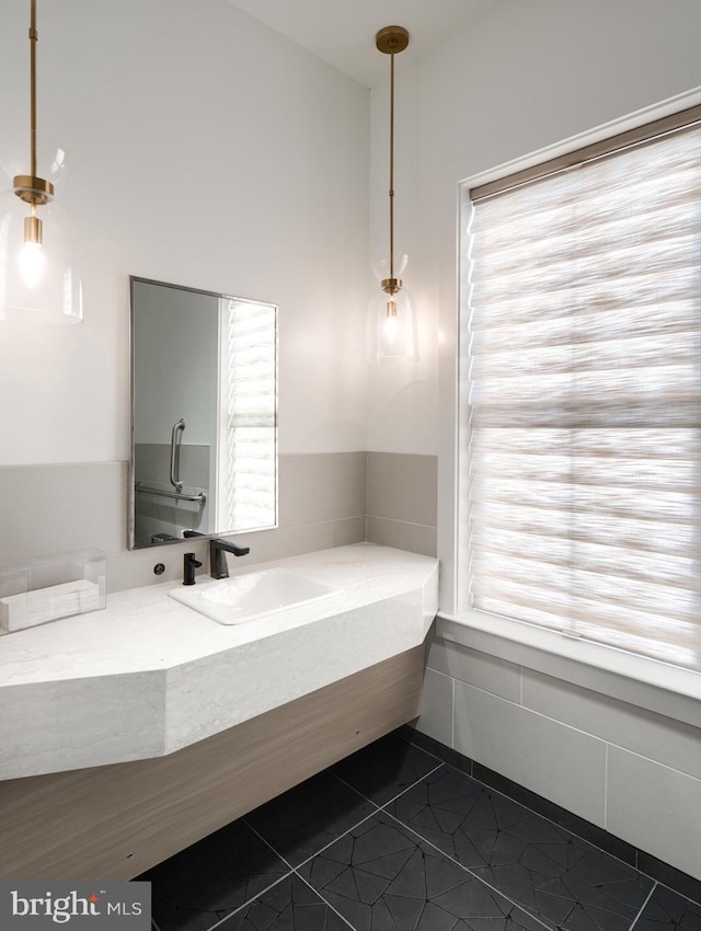 bathroom featuring tile patterned flooring and vanity