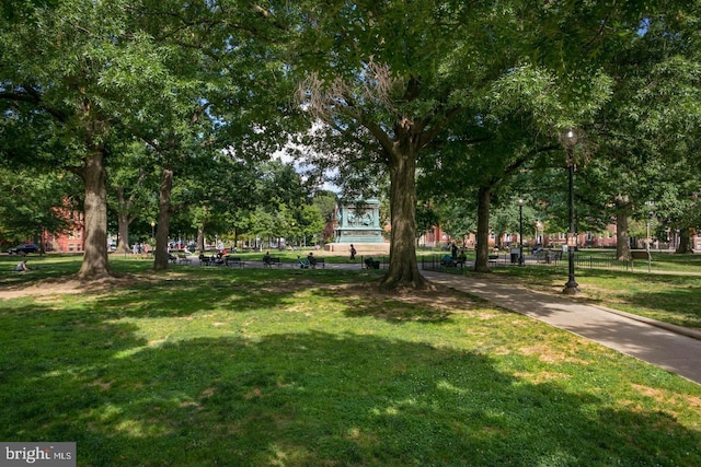 view of home's community featuring a lawn