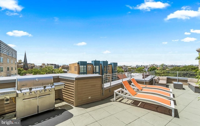 view of patio / terrace with a grill, outdoor lounge area, and a city view