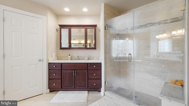 bathroom with recessed lighting, tile patterned floors, a shower stall, and vanity