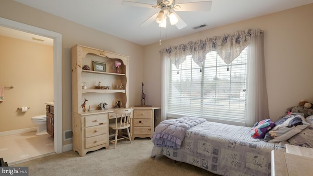 bedroom featuring ensuite bath, visible vents, ceiling fan, and light colored carpet