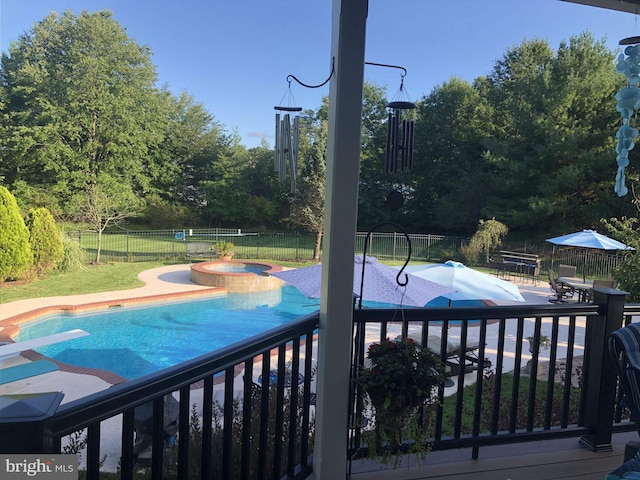 view of swimming pool featuring a fenced in pool, a patio area, a fenced backyard, and an in ground hot tub