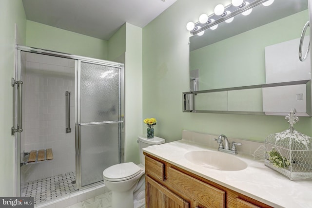 full bath with toilet, a stall shower, and vanity