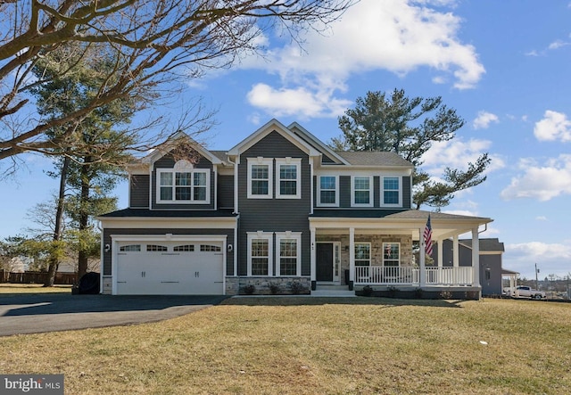 view of front of house with aphalt driveway, a porch, a front yard, stone siding, and an attached garage