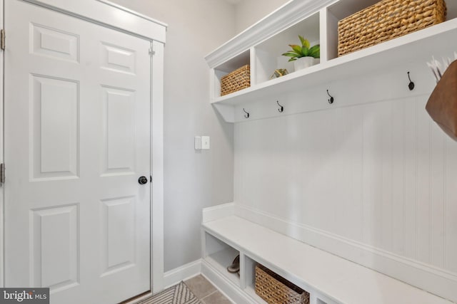 mudroom featuring tile patterned flooring and baseboards