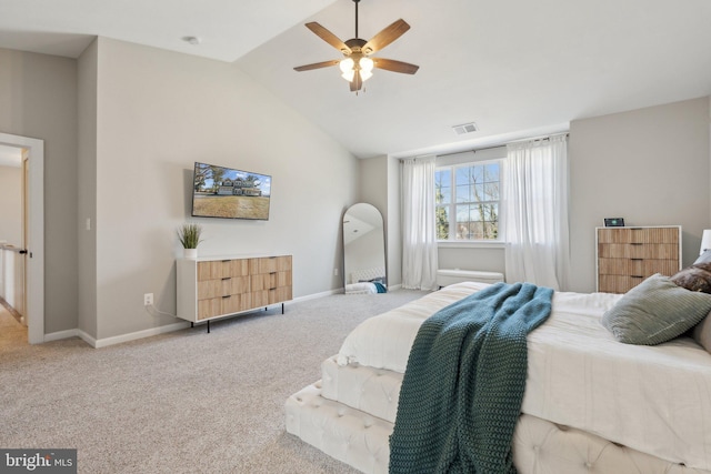 carpeted bedroom with visible vents, baseboards, lofted ceiling, and a ceiling fan