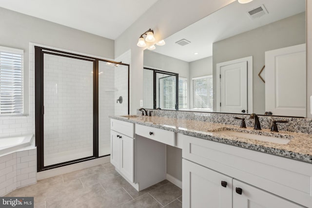 full bathroom with a sink, visible vents, a shower stall, and tile patterned floors