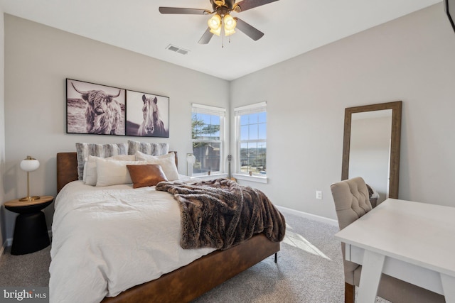 bedroom featuring ceiling fan, carpet, visible vents, and baseboards