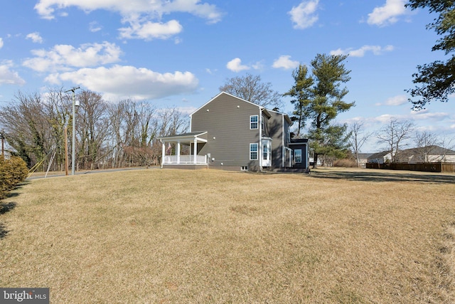 back of house with a yard