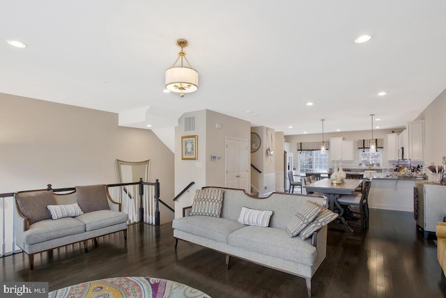 living area featuring dark wood-style floors, visible vents, and recessed lighting