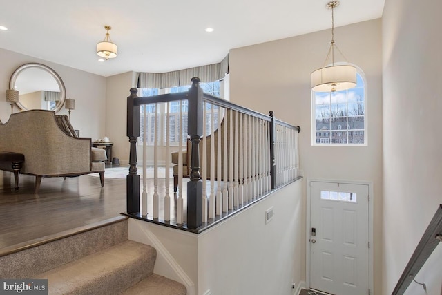 entryway with visible vents, stairway, and recessed lighting